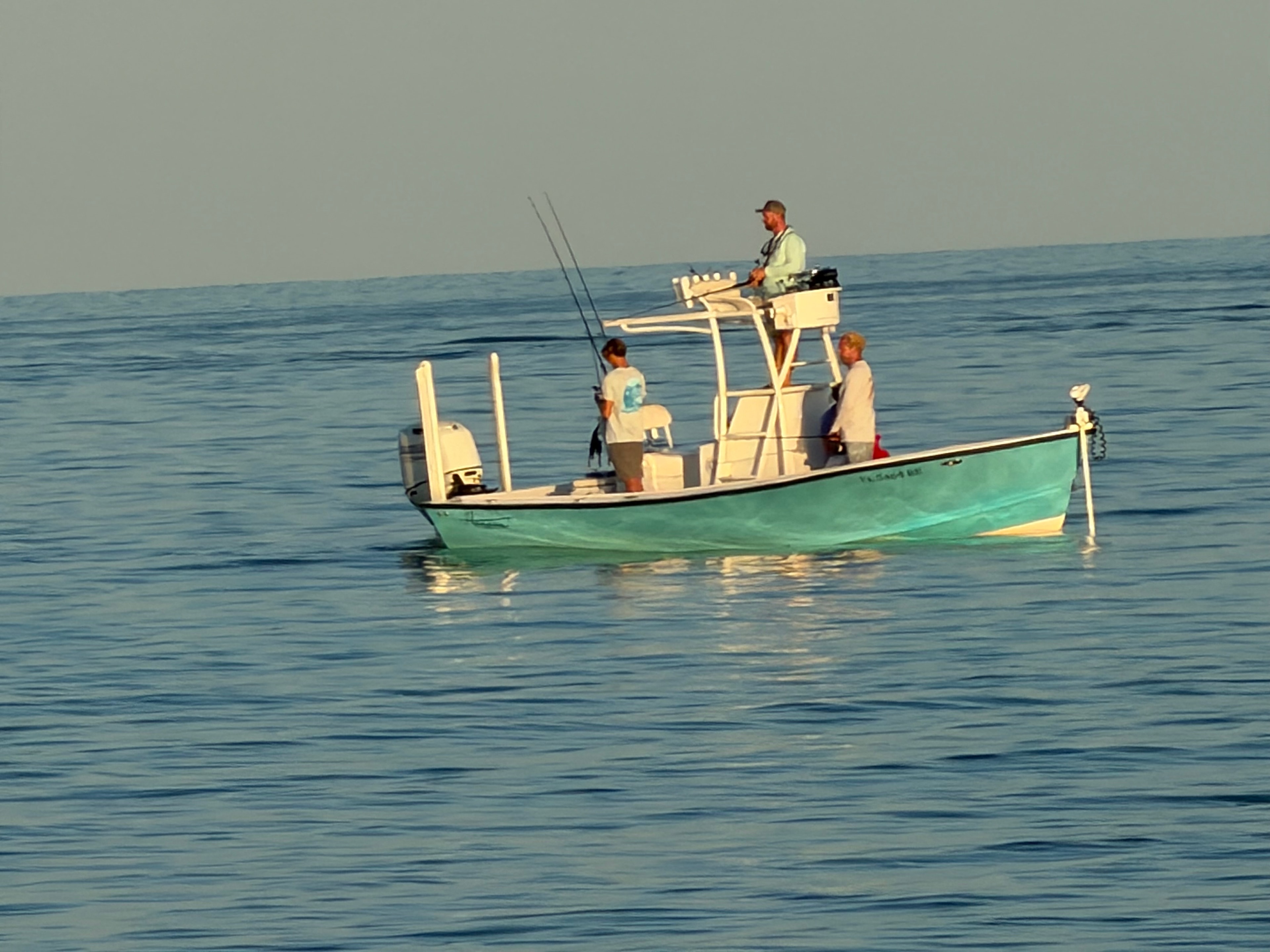 SWFL Fishing Charters crew on the water at sunrise