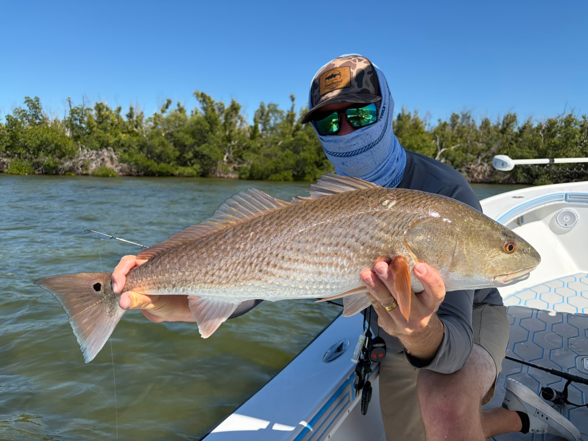 SWFL Fishing Charters captain on boat in Southwest Florida