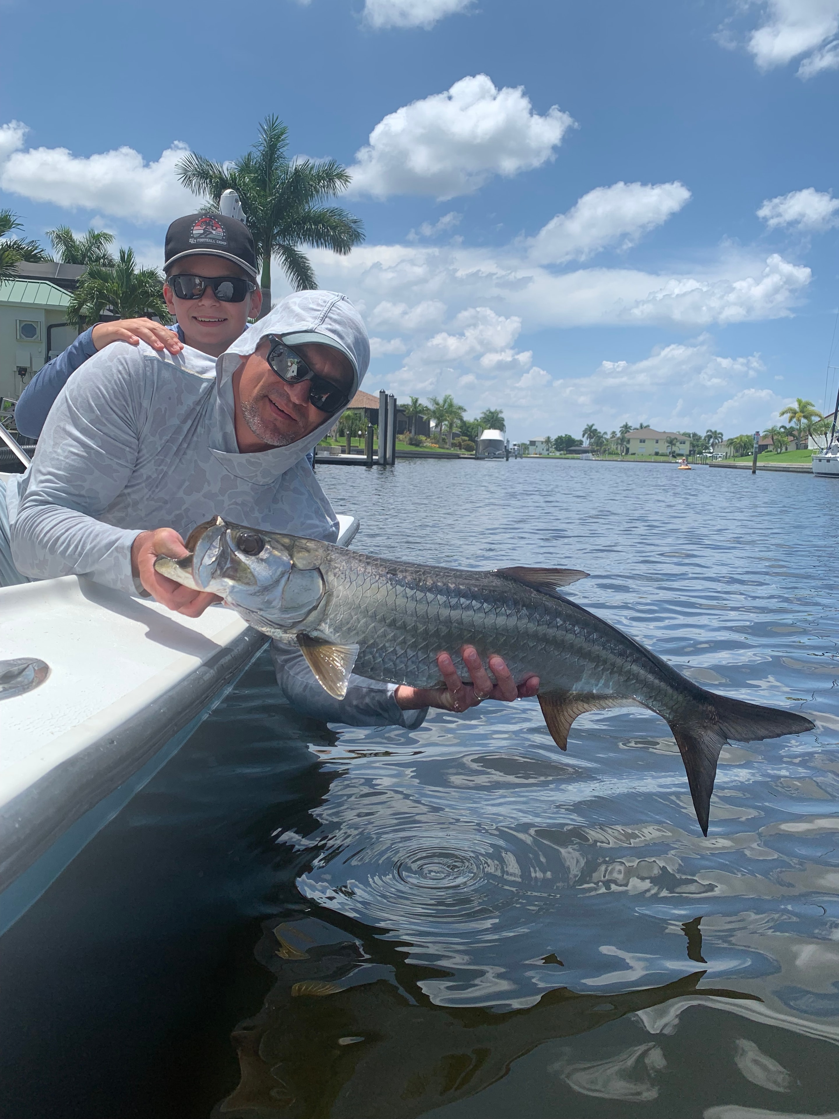 Angler and child with a tarpon catch-and-release in Southwest Florida